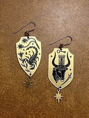 While Odin Sleeps Brass Zodiac Shield Drop Earrings with Scorpion & Bull Motifs